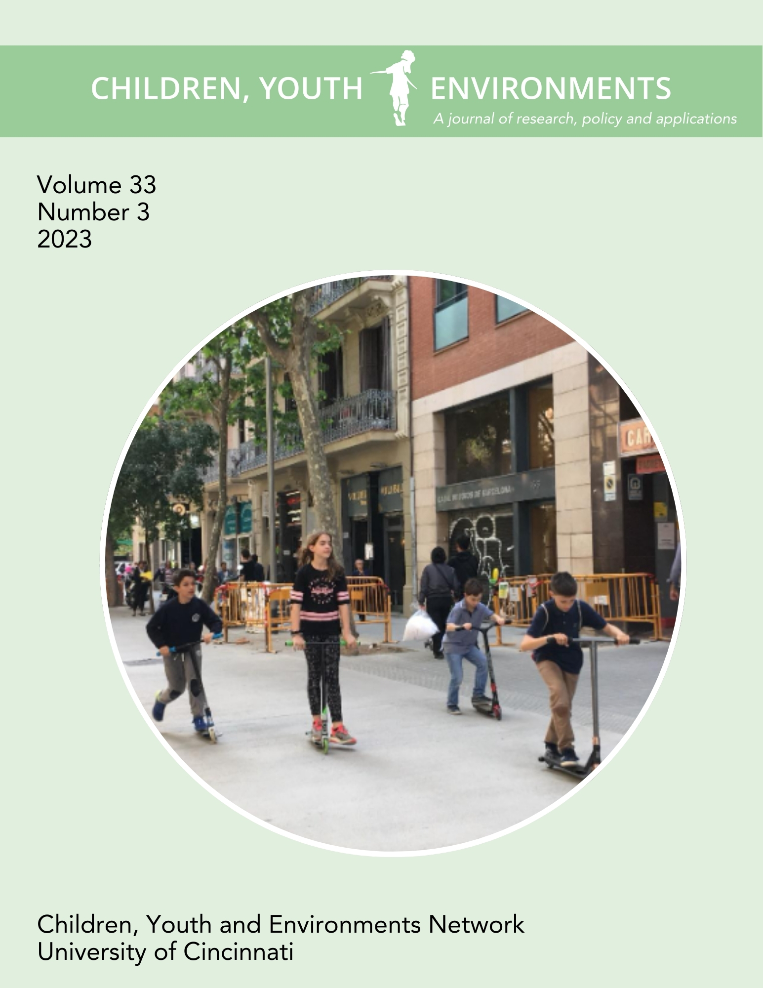 Children riding scooter on an urban sidewalk