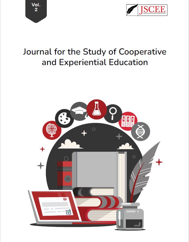 The title of the journal is "Journal for the Study of Cooperative and Experiential Education." This is Volume 1 Issue 1. Included is a design image of a laptop, books, and an ink well. There are also small images enclosed in circles including a globe, art palette, graduation cap, beaker, magnifying class, books, and DNA. Everything is themed in red, black, and grays.